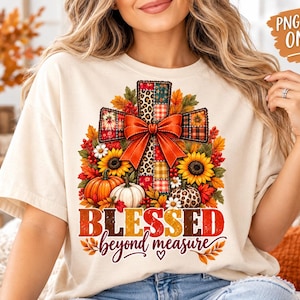 May include: A cream-colored t-shirt featuring a graphic of a cross decorated with a red bow, sunflowers, pumpkins, and autumn leaves. The text "BLESSED beyond measure" is printed in red and orange below the cross. A "PNG FILE ONLY" label is visible.