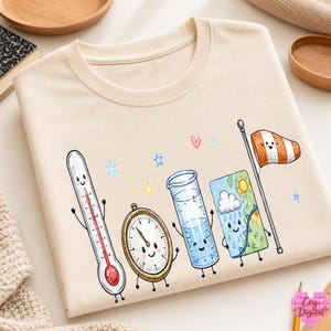 May include: A cream-colored t-shirt featuring a graphic print of anthropomorphic weather instruments including a thermometer, a barometer, a graduated cylinder, a weather map, and a windsock, accented by small colorful stars and hearts.