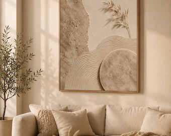 May include: A rectangular wall art piece in a wooden frame featuring a textured beige and tan composition. The artwork displays a layered design with a smooth section, a circular element, rippled sand-like patterns, and a single sprig of foliage.