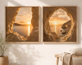 May include: A set of two square wall art prints featuring a golden sunset over a calm sea, viewed through a natural rock archway. The images display textured beige stone formations framing the water, with sunlight reflecting on the surface.
