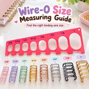 May include: A pink plastic Wire-O Size Measuring Guide with cutouts labeled 3/8, 7/16, 1/2, 9/16, 5/8, 3/4, 7/8, and 1 inch. Below the guide are eight metal binding wires in various colors, each corresponding to the labeled sizes above.