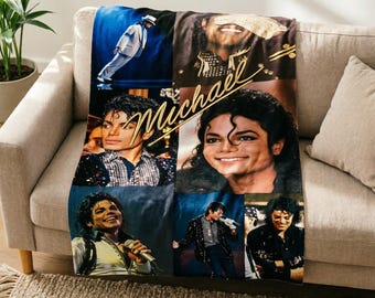 May include: A soft throw blanket featuring a collage of various photographs of Michael Jackson in different performance outfits and poses, with the name Michael written in a gold cursive script across the center of the fabric design.