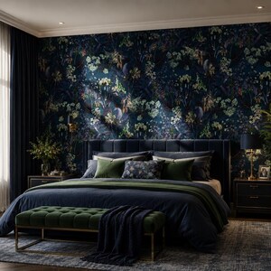 May include: A bedroom featuring dark blue floral wallpaper, a navy blue upholstered bed with green and patterned pillows, a dark blue duvet, a green velvet bench with a gold frame, two dark nightstands, and a tall green potted plant.