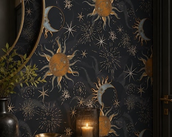 May include: Wallpaper featuring a dark black background with a repeating pattern of golden suns and blue crescent moons, interspersed with various star shapes and radiating light bursts. The design includes celestial motifs in a vintage style.