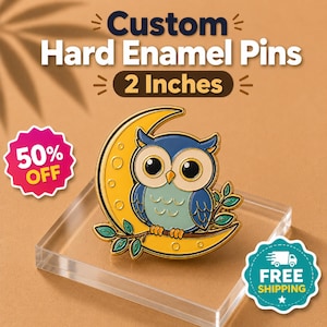 May include: A hard enamel pin featuring a blue and cream-coloured owl perched on a yellow crescent moon with green leaves. The pin is 5.08 cm in size. Text on the image reads Custom Hard Enamel Pins, 2 Inches, 50% OFF, and FREE SHIPPING.