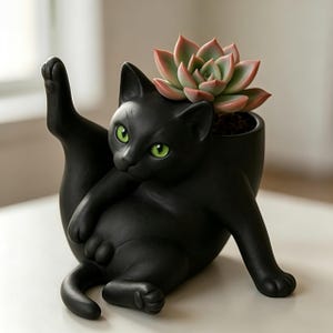 Handcrafted matte black cat-shaped succulent flower pot. Weird lying cat flower vase.