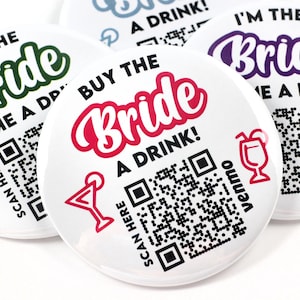 May include: Four round white buttons with different colored text and designs. The buttons say "I'm the Bride" and "Buy me a drink!" with a QR code and a cocktail glass icon. The text is in different colors, including green, pink, purple, and blue.