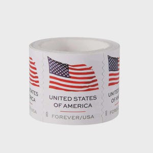 May include: A roll of postage stamps featuring a graphic of the American flag in red, white, and blue. The text reads UNITED STATES OF AMERICA and FOREVER/USA with the year 2025 printed on the side. The stamps have perforated edges.