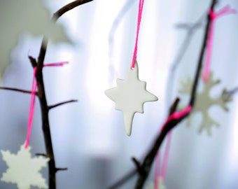 Small snowcrystal, modern christmas decoration made of porcelain