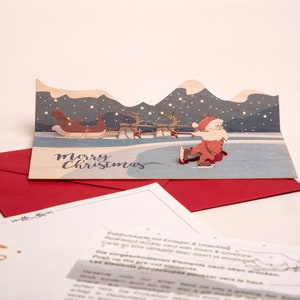 3 cartes pop-up en bois avec enveloppes – Père Noël sur glace