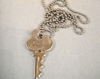 Cute Vintage 1960s American Tourister Luggage Smiling Bellhop Mascot Suitcase Key necklace