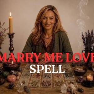 May include: A person sits behind a wooden table covered with tarot cards, crystals, candles, and incense. The text MARRY ME LOVE SPELL is overlaid in red and white. The scene includes a lit candle in a tall holder, a smoking incense burner, and a crystal ball.