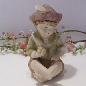 Boy Piano Baby Figurine Design Studio 6682 Vintage Ceramic Figurine Boy Sitting with Crossed Legs Holding Apple with Feather in Hat Gift