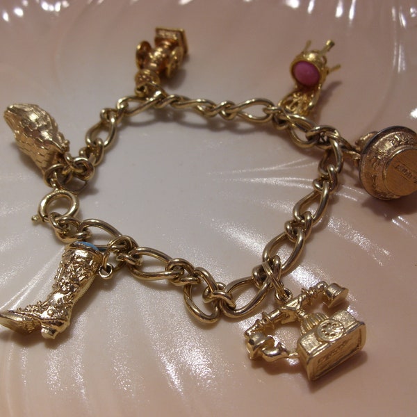 Avon Gold Tone Charm Bracelet with Six Charms Includes Owl, Telephone, Boot, Chair, Coffee Grinder and Pitcher and Bowl Vintage Collectible