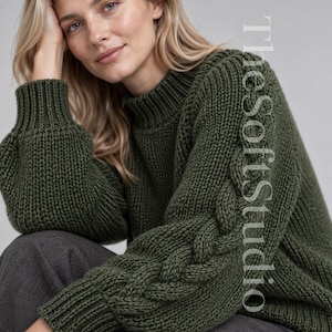 May include: An olive green long-sleeve sweater featuring a mock neck, ribbed cuffs, and a prominent cable knit pattern running down the length of the sleeves. The text TheSoftStudio is printed vertically in white on the right side of the garment.