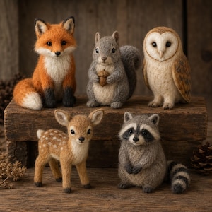 May include: A collection of five needle-felted animal figurines including a red fox, a grey squirrel holding an acorn, a barn owl, a spotted fawn, and a raccoon with a striped tail, all crafted with textured wool fibres.