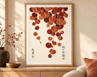 May include: A framed wall art print featuring a cascading arrangement of round, rust-colored autumn leaves against a cream background. The artwork includes black Japanese calligraphy text on the left and right sides, along with small red square stamps.
