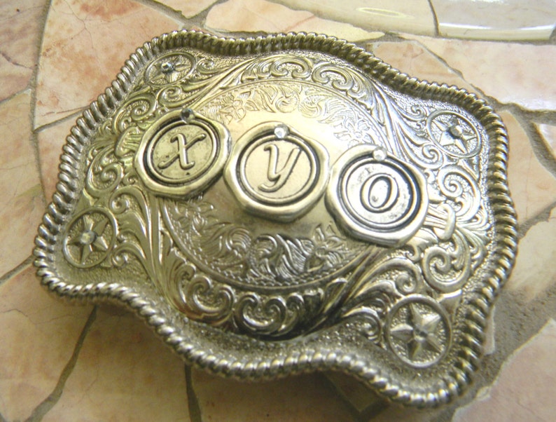 silver belt buckle with initials