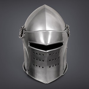 May include: A polished silver-colored metal knight helmet featuring a pointed crown, a horizontal eye slit, and a lower section with three rows of ventilation holes. Small metal chains are attached to both sides of the visor hinge mechanism.