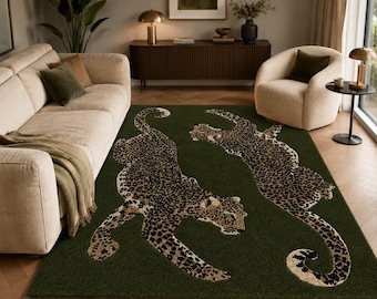 May include: A rectangular area rug featuring a deep forest green background with two large, stylized leopard figures. The leopards are depicted with detailed black and tan spotted fur patterns, shown in a dynamic, prowling pose across the surface.