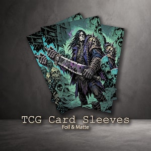 May include: A stack of TCG card sleeves featuring a dark fantasy illustration of a long-haired warrior in blue armor holding a large blade, surrounded by skulls and a teal background. The text TCG Card Sleeves Foil & Matte is printed below.