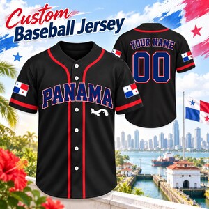 May include: A black baseball jersey with red trim, featuring the text PANAMA in blue with white outlines on the front, a small white map graphic, and the Panama flag on the sleeves. The back displays the text YOUR NAME and the number 00 in blue.