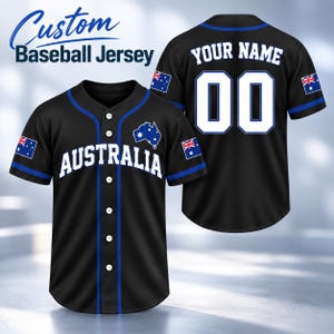 May include: A black baseball jersey with blue piping, featuring the text AUSTRALIA on the front, a map of Australia, and the Australian flag on the sleeves. The back displays the text YOUR NAME and the number 00 in white with blue outlines.