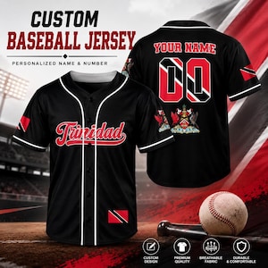 May include: A black baseball jersey with white piping, featuring the word Trinidad in red script on the front, a Trinidad and Tobago flag patch, and a back design with the text Your Name, the number 00, and the Trinidad and Tobago coat of arms.