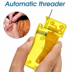 May include: A bright yellow plastic automatic threader tool with a visible internal metal spring mechanism. The device features a rectangular body with a lever and a small needle guide at the top. The text Automatic threader is displayed above.