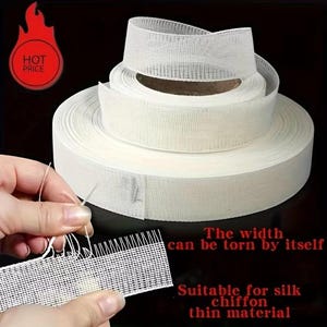 May include: A roll of white, semi-sheer, grid-patterned fabric tape with a visible weave. The text on the image reads: HOT PRICE, The width can be torn by itself, Suitable for silk chiffon thin material.