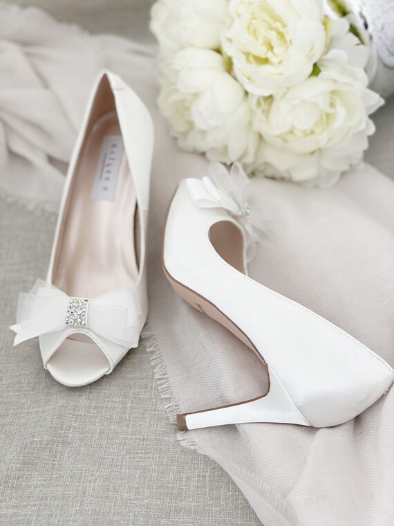 white heels with a bow