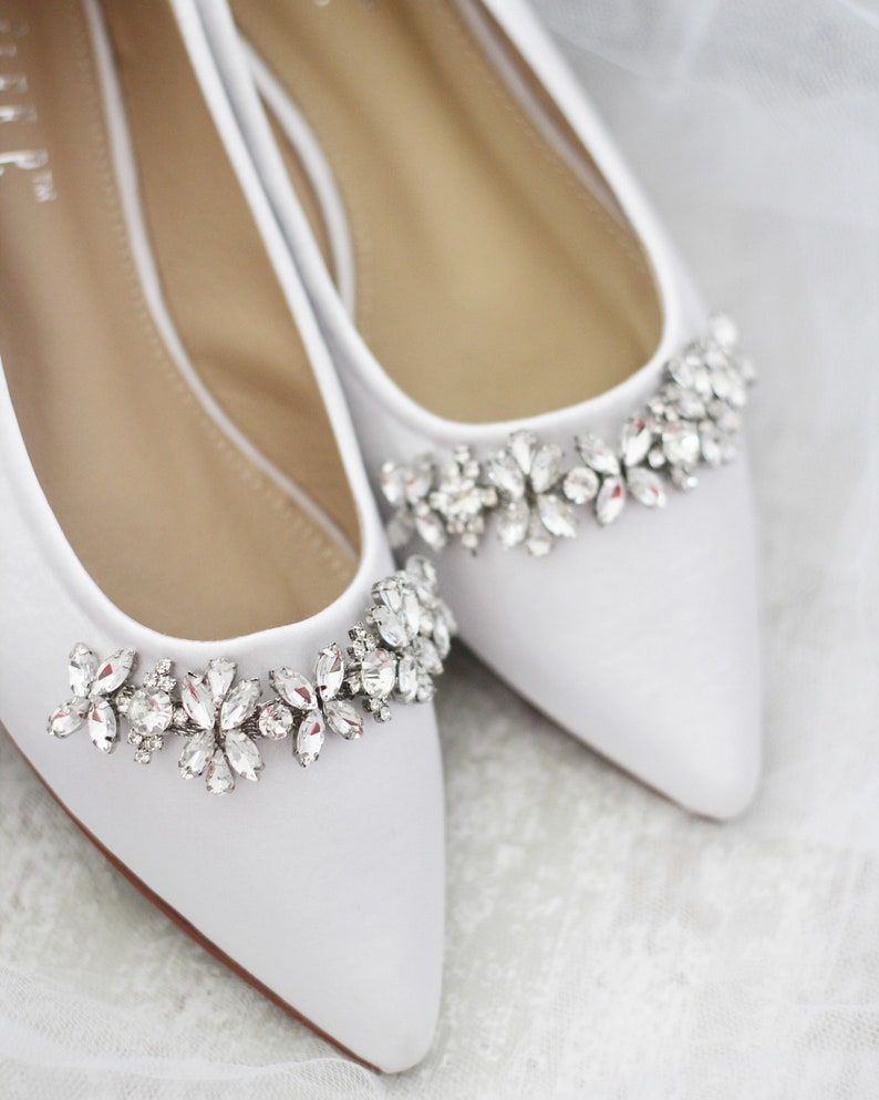 white pointy flats