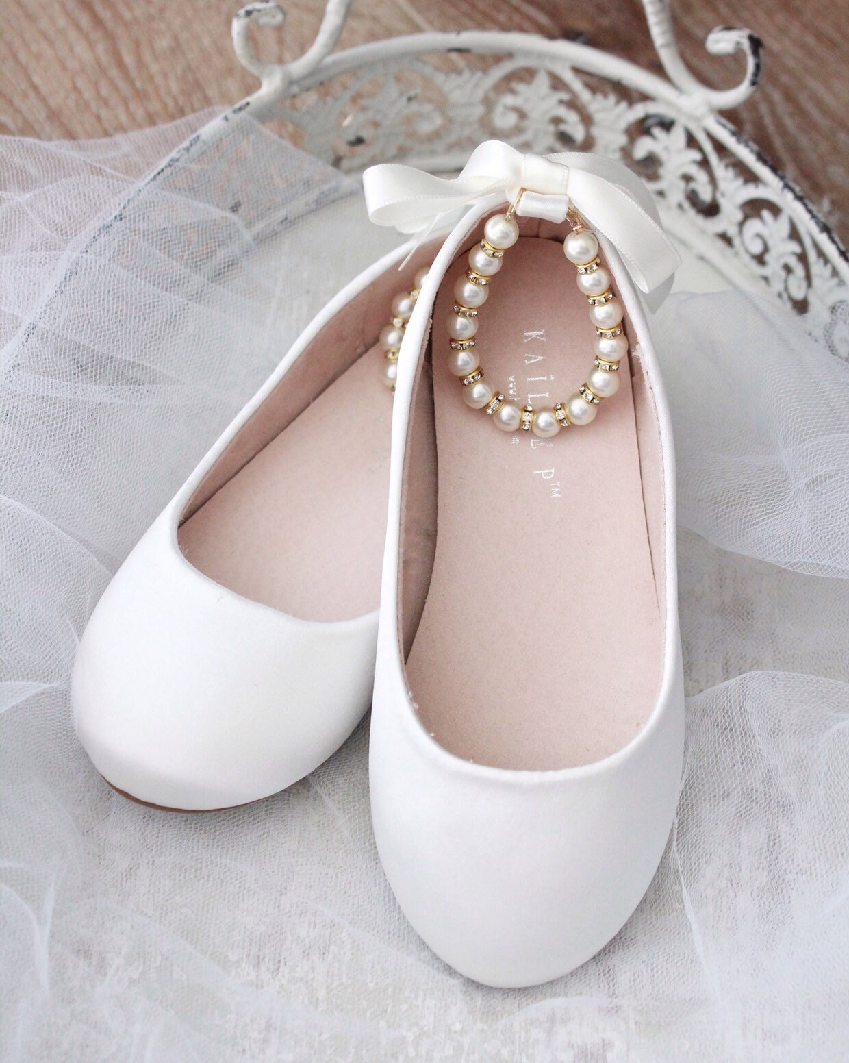 white flats with pearls