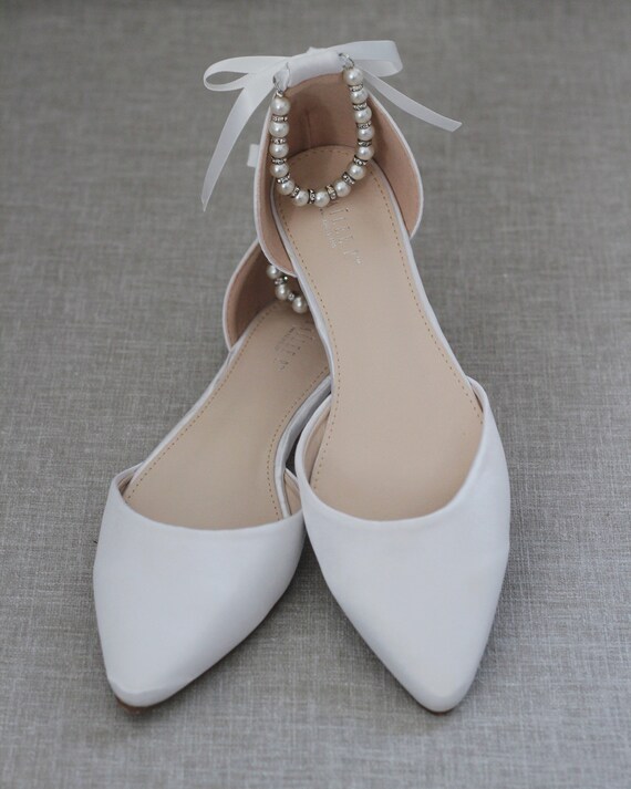 white flats with ankle strap