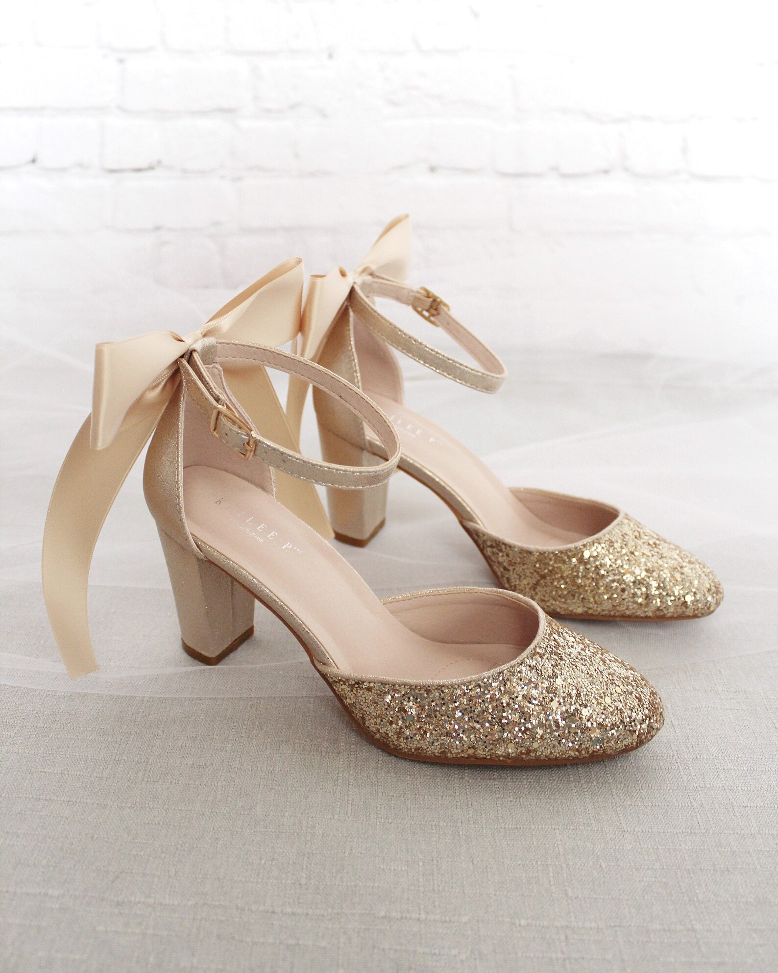 gold bow block heel