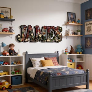 May include: A wall-mounted wooden sign spelling the name JAMES in large, black-outlined letters. Each letter is filled with a collage of magical-themed illustrations, including wands, potions, books, and stars, set against a dark background.