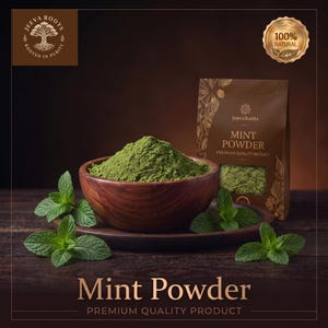 May include: A wooden bowl filled with green mint powder sits on a matching wooden plate, accompanied by fresh mint leaves. Beside it is a brown pouch labeled JeevaRoots Mint Powder Premium Quality Product, featuring a 100% Natural gold seal.
