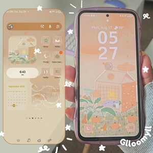 Puede incluir: Dos teléfonos inteligentes que muestran una interfaz digital personalizada con una paleta de colores naranja y beige cálidos. Las pantallas presentan una ilustración de cartón de leche, un calendario e iconos de aplicaciones. Un teléfono tiene una funda morada translúcida con bordes ondulados.