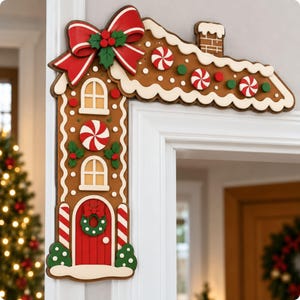 May include: A gingerbread house-themed door corner decoration featuring a red door, white icing accents, peppermint candy details, and a large red bow. The brown structure includes two windows, a chimney, and green holly leaves.