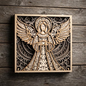 May include: A square, multi-layered wooden wall art piece featuring a laser-cut design of an angel with outstretched wings. The artwork uses varying shades of light and dark wood to create depth, showcasing intricate filigree patterns throughout.