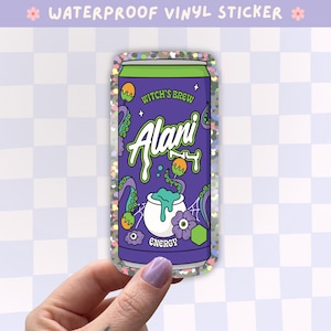 May include: A waterproof vinyl sticker featuring a purple energy drink can with a holographic finish. The design includes the text Witch's Brew and Alani Nu, with illustrations of a bubbling white cauldron, green tentacles, spider webs, and purple flowers.