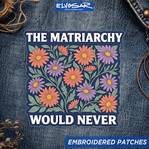 May include: A square sticker featuring a dark blue background with orange and purple daisy-like flowers and green leaves. The text THE MATRIARCHY is printed in white at the top, and the text WOULD NEVER is printed in white at the bottom.