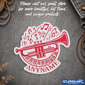 May include: A red and white embroidered patch featuring a trumpet, musical notes, and piano keys. The text "ANYNAME" is stitched at the bottom. The patch is displayed on a dark grey textured background with the text "Please visit our small store for more beautiful, hot trend, and unique products."