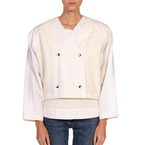 May include: A white cropped jacket with a double-breasted closure and a textured design on the front and back.