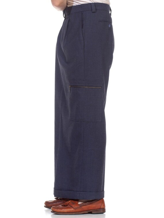 Ingrid Van De Wiele dark blue wide trousers with one open leg over shorts —  1990's - V A N II T A S