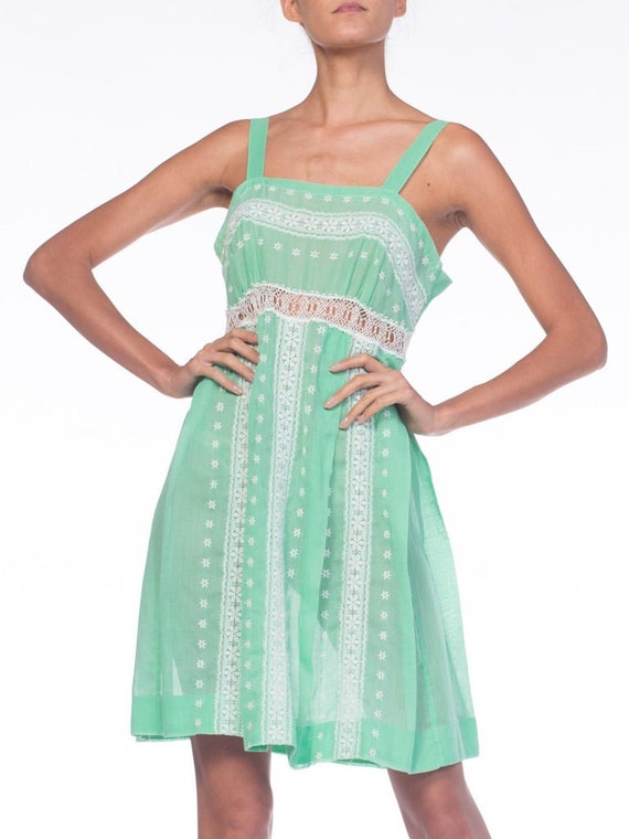 green emerald velvet dress Rivia Eyelet Ruffled Flare Dress In Mint Green – The Design Closets main image 1
