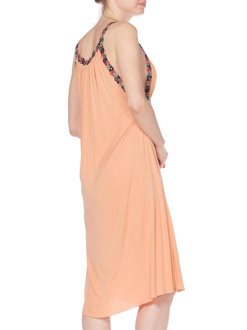 MORPHEW COLLECTION Peach Silk Jersey Dress With Cutout Front & 1930S Floral Trim image 2