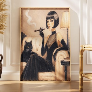 May include: A framed wall art print depicting a person with a black bob haircut wearing a black dress and long gloves, holding a cigarette holder while sitting on a tufted sofa next to a black cat. A lamp stands on a small table nearby.