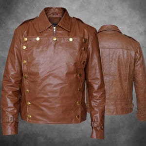 May include: A brown leather jacket featuring a double-breasted front panel with gold-toned metal buttons, a classic collar, and adjustable buckled straps at the cuffs. The jacket is shown from both the front and the back to display the design.