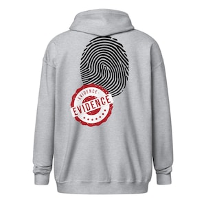 May include: A light gray hooded sweatshirt featuring a black fingerprint graphic on the back. Overlaid on the fingerprint is a red circular stamp design with a white banner containing the word EVIDENCE in black capital letters.